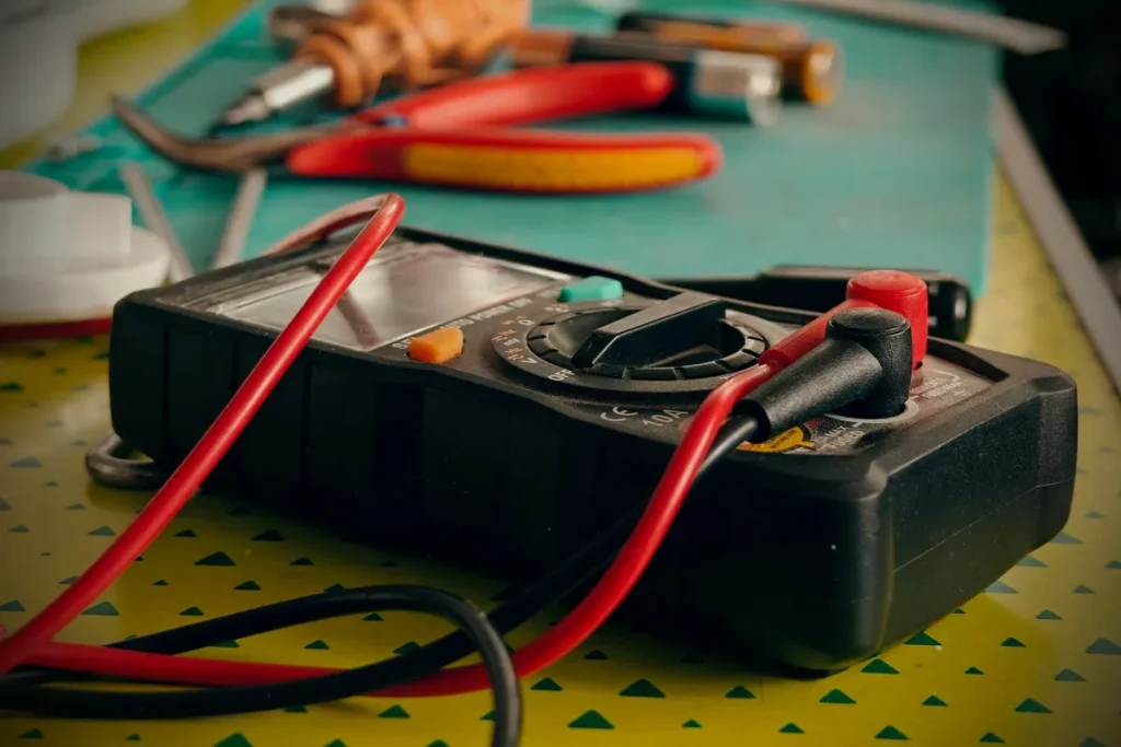 Multimeter and test leads for electrical inspection and troubleshooting