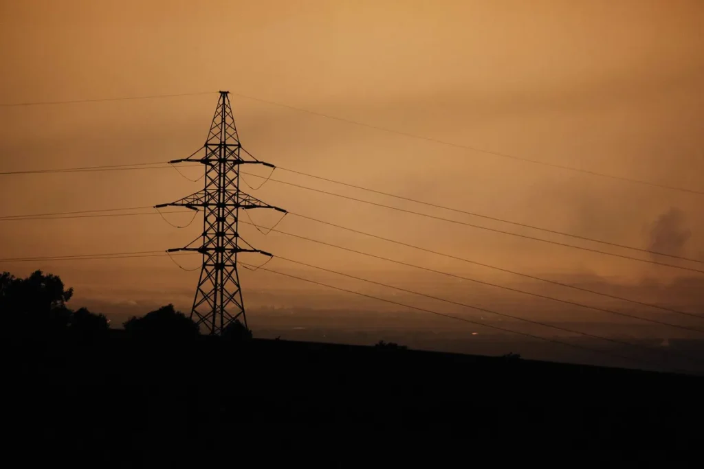 Power lines at dusk. Standby generators keep homes powered during outages
